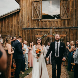 Newlyweds-Walking-Up-The-Aisle-After-Wedding-At-The-Barn-On-Birmingham-Milton-GA-Event-Venue Newlyweds-Walking-Up-The-Aisle-After-Wedding-At-The-Barn-On-Birmingham-Milton-GA-Event-Venue